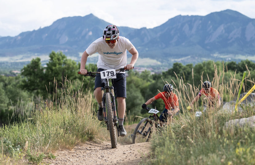 Me in a bike race with the flatirons in the background